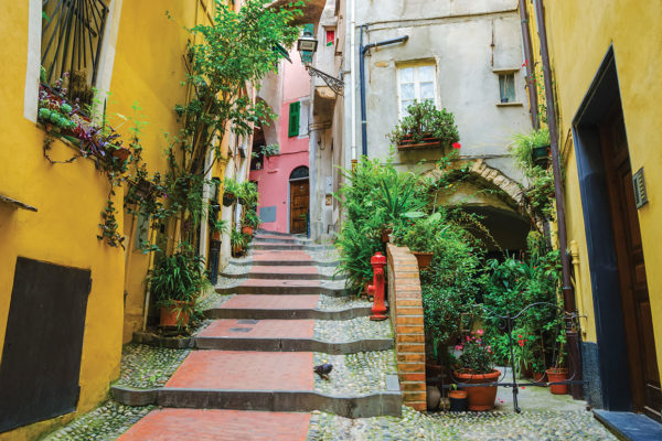 colourful buildings on a steep street with steps in San Remo