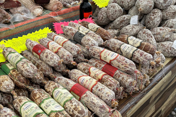 Market stall loaded with cured meats