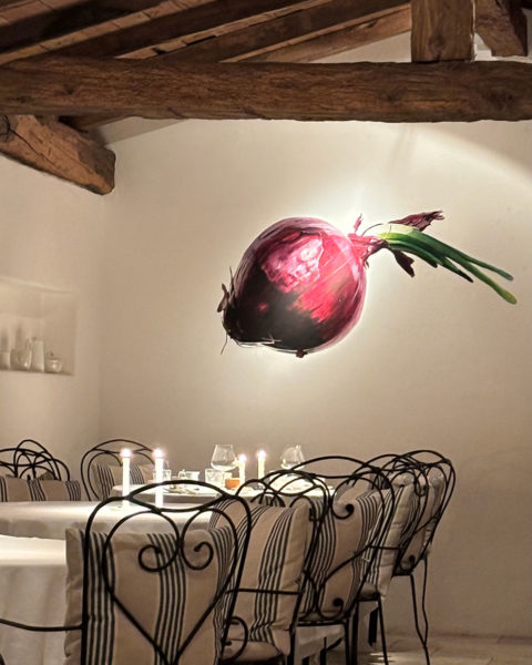 Restaurant interior - cosy restaurant in Autumn with beetroot mural on wall. 